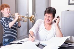 Interior view of study in flat with desk and white shutters