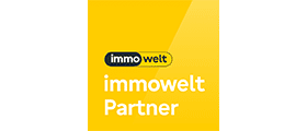 Logo der immowelt Partner auf gelbem Hintergrund mit weißem und schwarzem Schriftzug