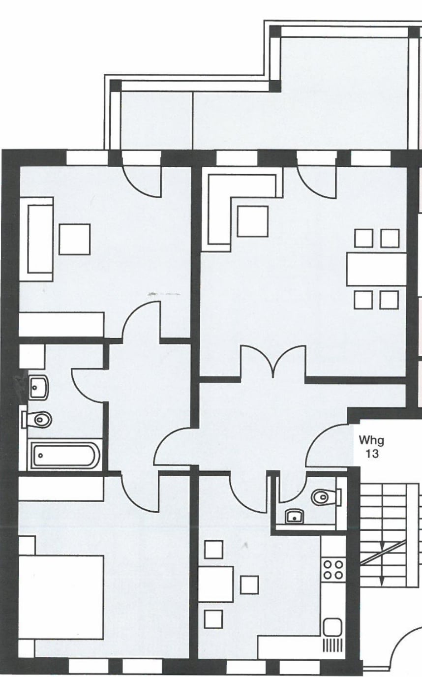 Grundriss einer 3-Zimmer-Wohnung mit separater Küche, Bad, Gäste-WC und Balkon in Draufsicht